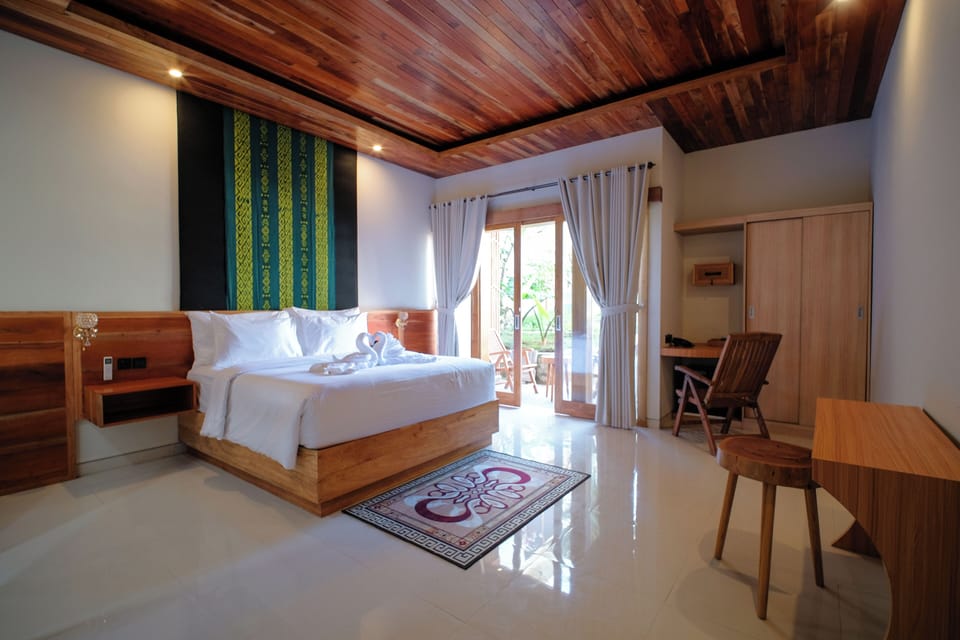 Deluxe Double Room, Pool View | Minibar, in-room safe, desk, laptop workspace