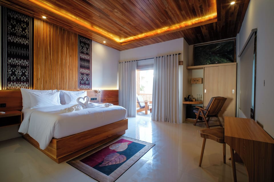 Deluxe Double Room, Pool View | Minibar, in-room safe, desk, laptop workspace