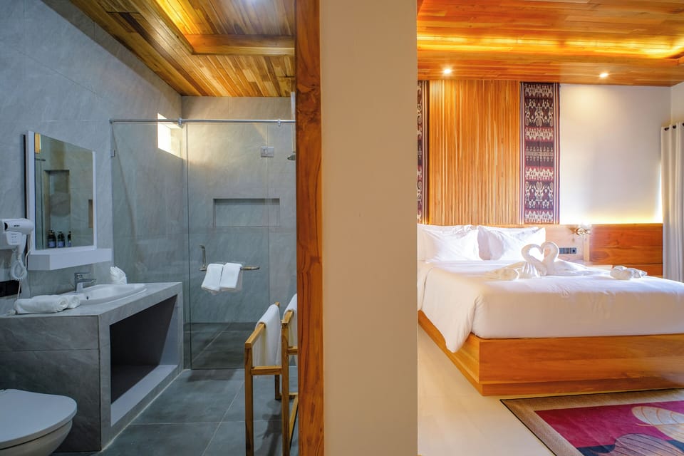 Deluxe Double Room, Pool View | Bathroom | Shower, hair dryer, towels, soap