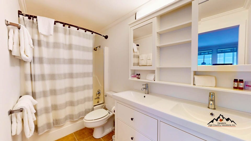 Step into your bright, updated bathroom with fresh towels waiting, a tub-shower combo, and ample storage to unpack and unwind in style.