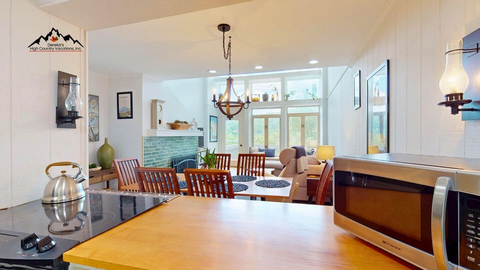 You'll love the open-concept layout with sleek counters, modern appliances, and a cozy dining space bathed in natural light. Perfect for preparing meals together and gathering around the table.