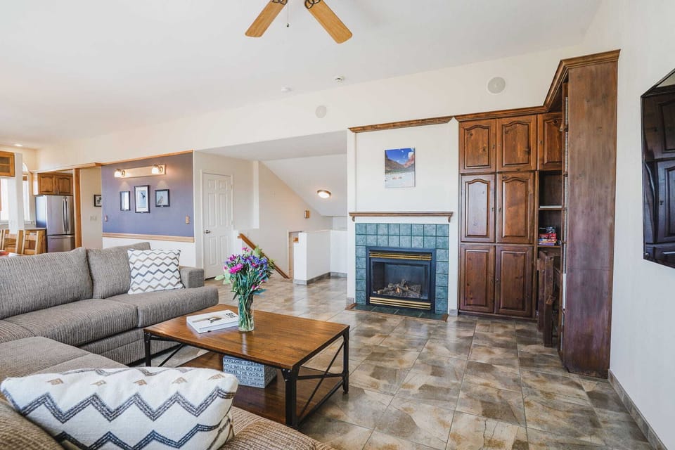 Spacious and inviting open-concept living area, perfect for relaxing by the fireplace or entertaining. Comfort meets convenience!