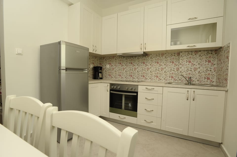 Family Villa, Beachfront | Private kitchen | Full-size fridge, stovetop, coffee/tea maker, electric kettle