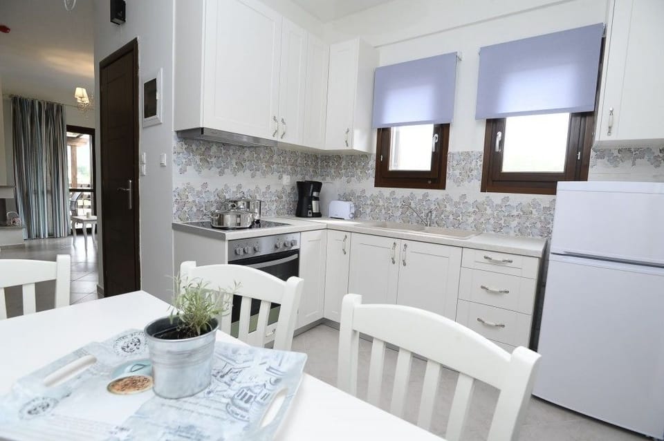 Family Villa, Beachfront | Private kitchen | Full-size fridge, stovetop, coffee/tea maker, electric kettle