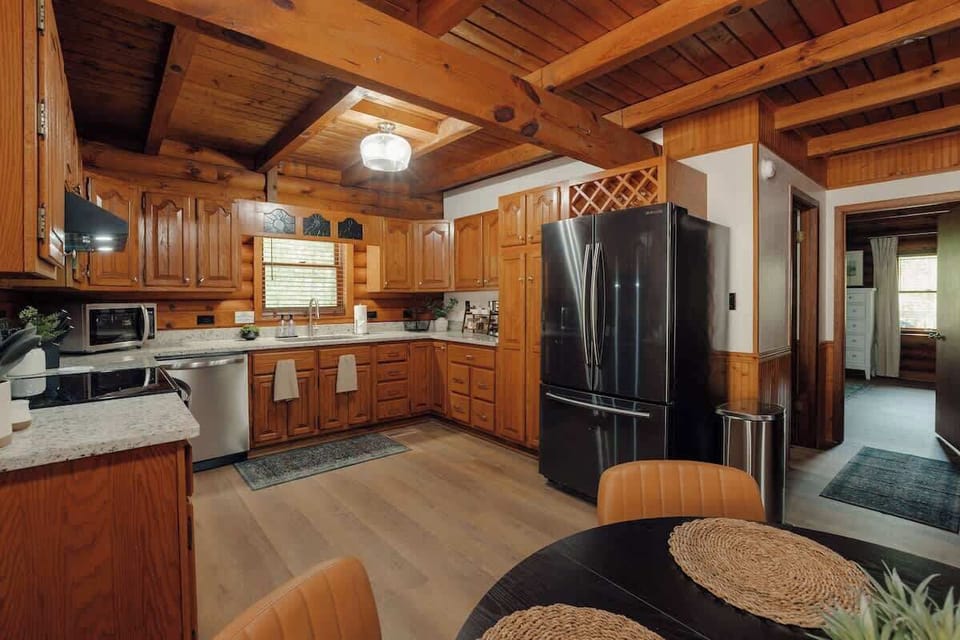 Spacious kitchen and dining area with modern appliances, abundant counter space, and an open layout designed for gathering, cooking, and sharing meals together.