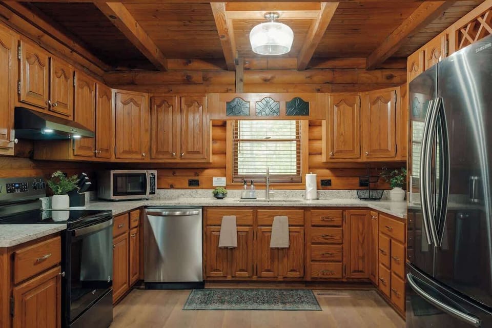 Fully stocked kitchen with ample counter space, modern appliances, and everything needed to prepare meals for your group during your stay.