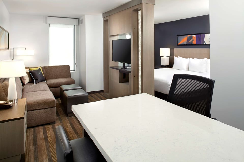Premium bedding, desk, blackout drapes, iron/ironing board
