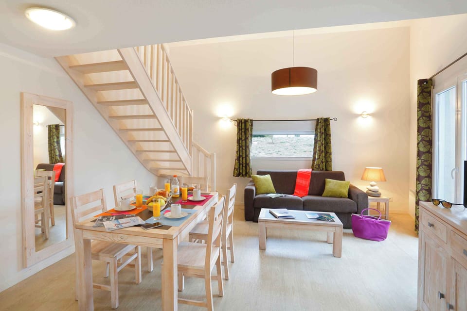 A second view of the living and dining area, with direct access to the fully fitted kitchen.