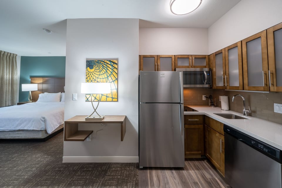 Enjoy a tastefully furnished studio with sleek appliances and warm lighting, designed for your comfort.