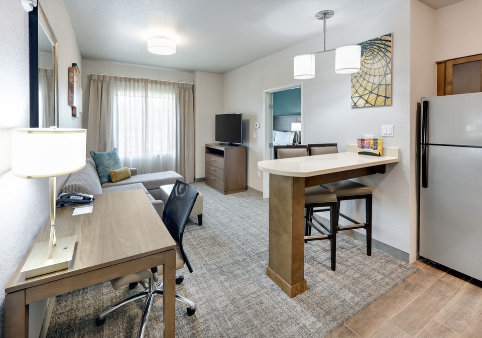 Bright, inviting suite with separate living space and convenient amenities.