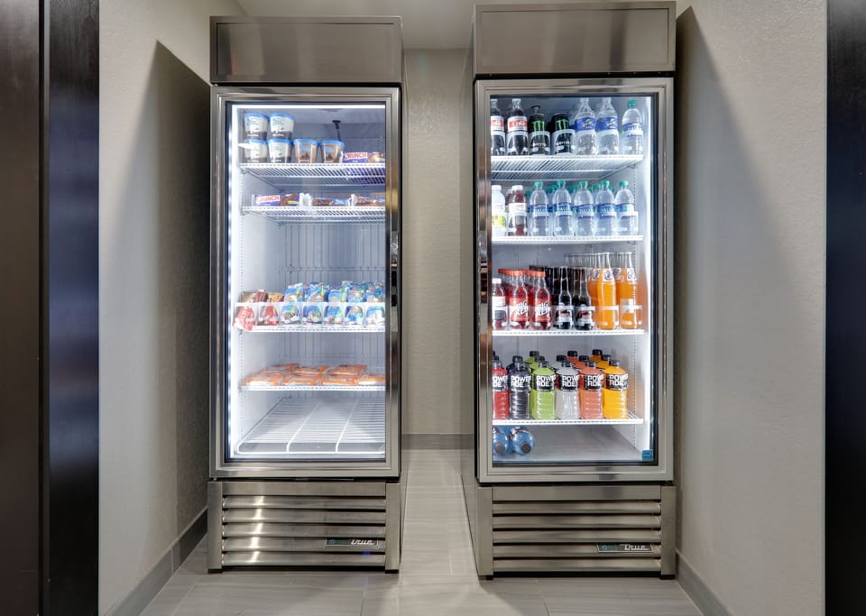 Refrigerators stocked with snacks and beverages available around the clock.