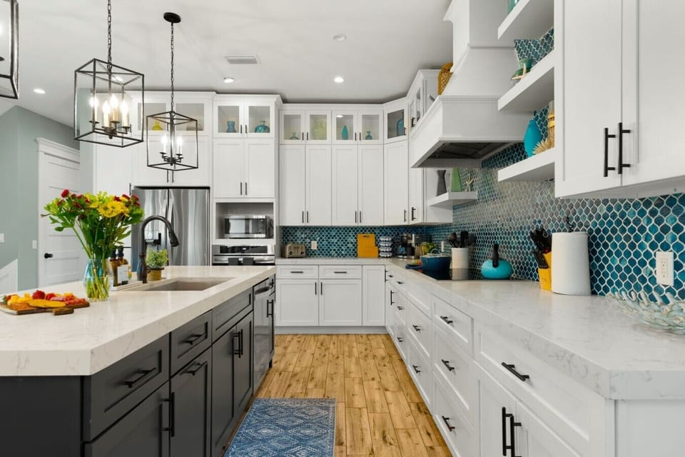 The Gourmet Kitchen: Welcome to the culinary heart of the home, showcasing a massive island and professional-grade appliances that will inspire your inner chef.