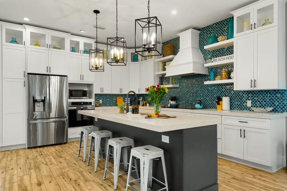 The Kitchen Island: Anchored by a prep island with comfortable bar seating, this central hub keeps the chef connected to every conversation.