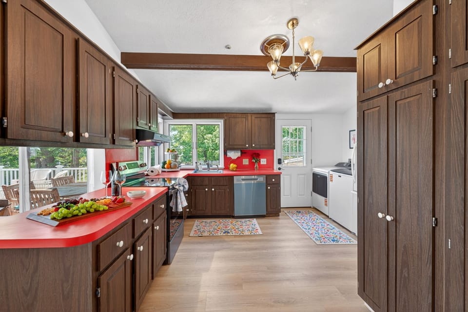 Warm and inviting kitchen featuring wood cabinets and modern appliances for a stylish and functional space.