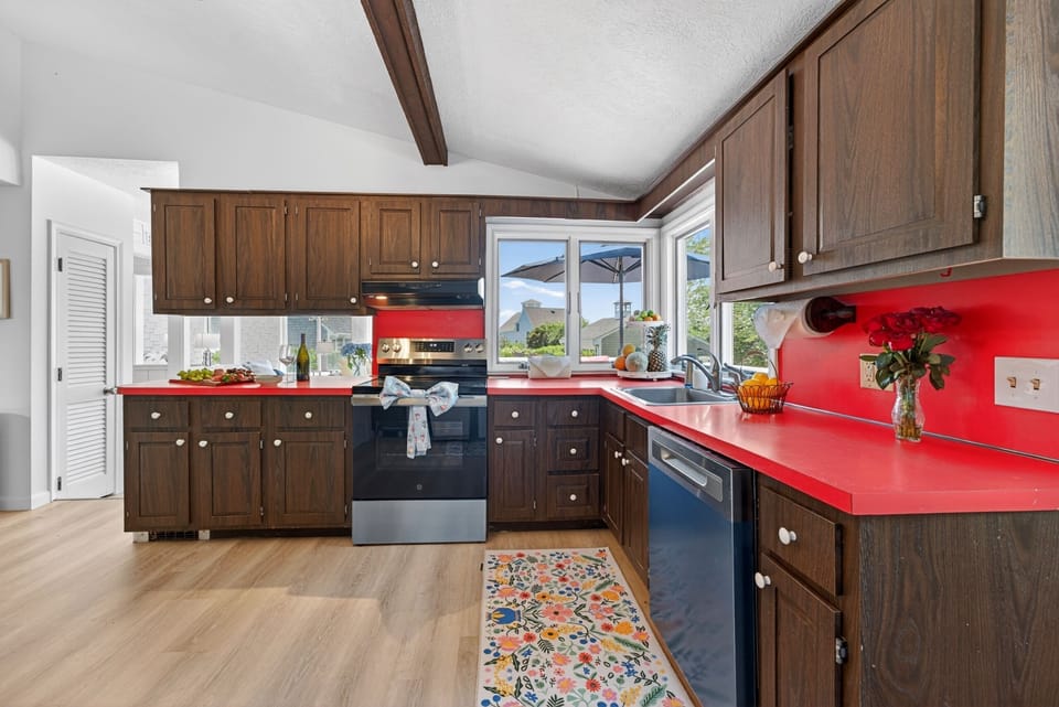 Inviting kitchen designed with warm wood finishes and quality appliances, ideal for cooking, entertaining, or enjoying quiet mornings in a comfortable home-like atmosphere.
