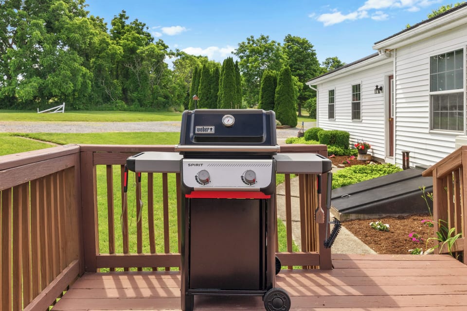 Full-size grill on the deck for family cookouts and relaxing outdoor meals.