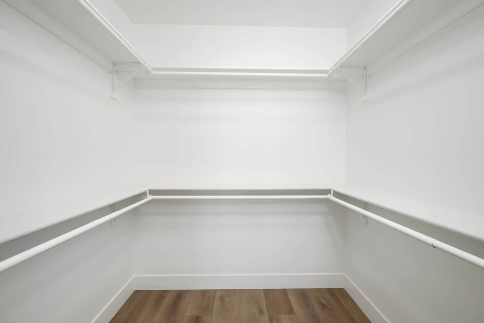 Walk-in closet with plenty of storage space. Unit 2.