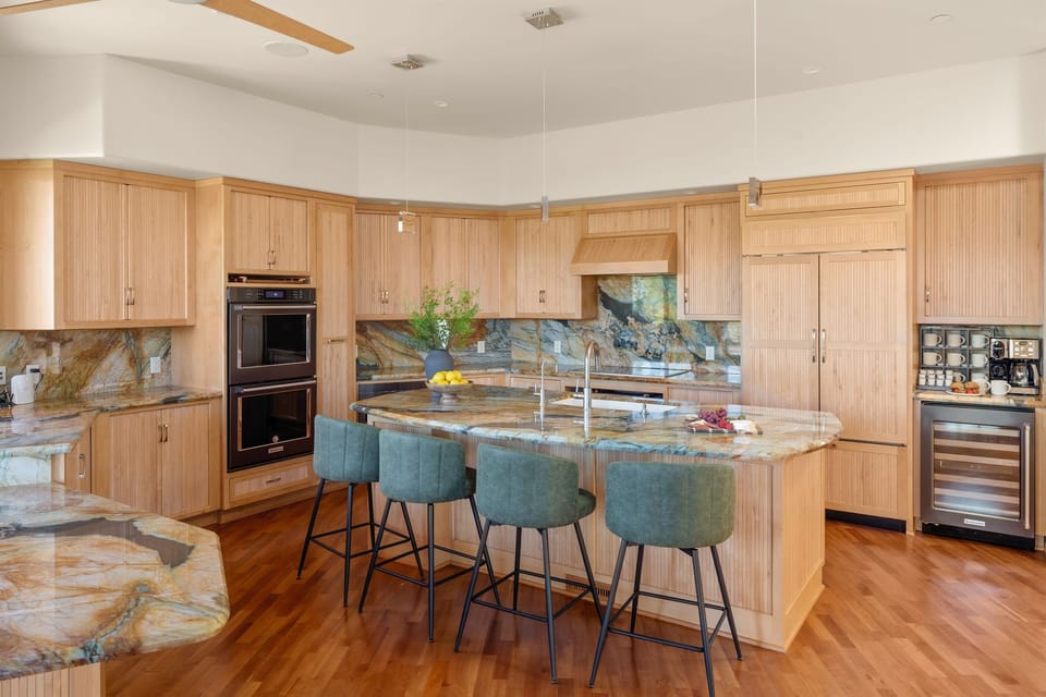 The heart of the home. Our fully equipped chef's kitchen features expansive marble countertops, premium appliances, and massive island seating perfect for entertaining.