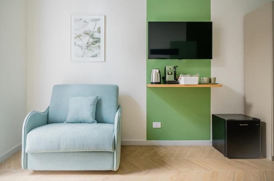 Superior Double Room, Balcony, City View | Living area | TV