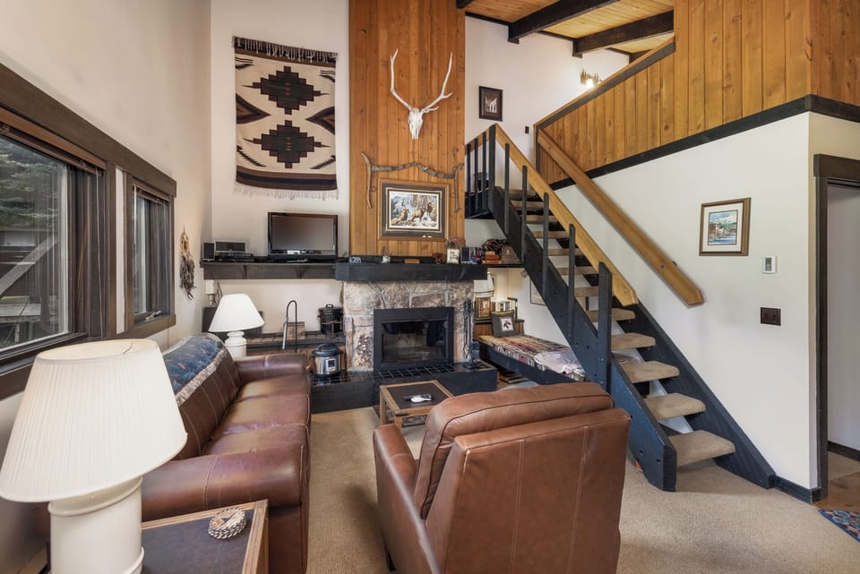 Rustic retreat with cozy fireplace | Main Level