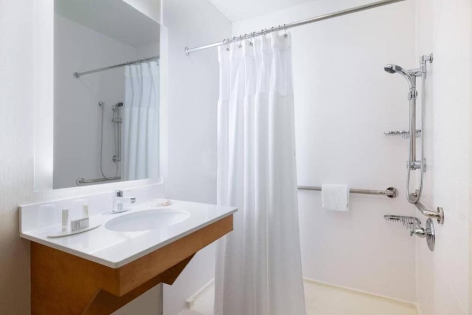 Feel at ease with accessible grab bars and handheld shower.