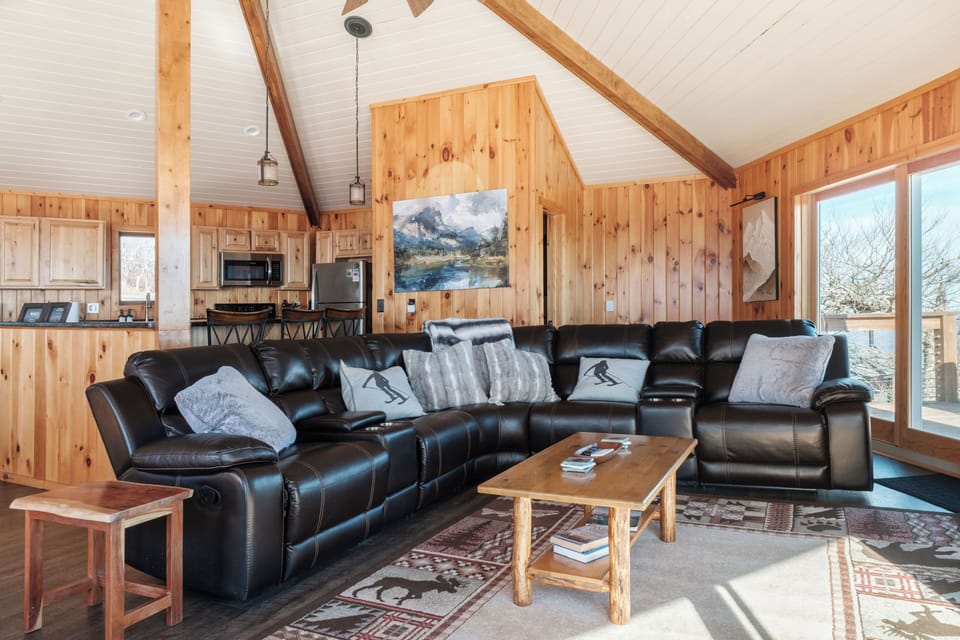 Spacious open-concept layout with a large sectional and mountain views. Perfect for groups to relax together after the slopes or a day exploring Banner Elk.