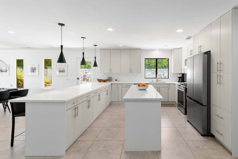 Features high-end stainless steel appliances and a beautiful island.