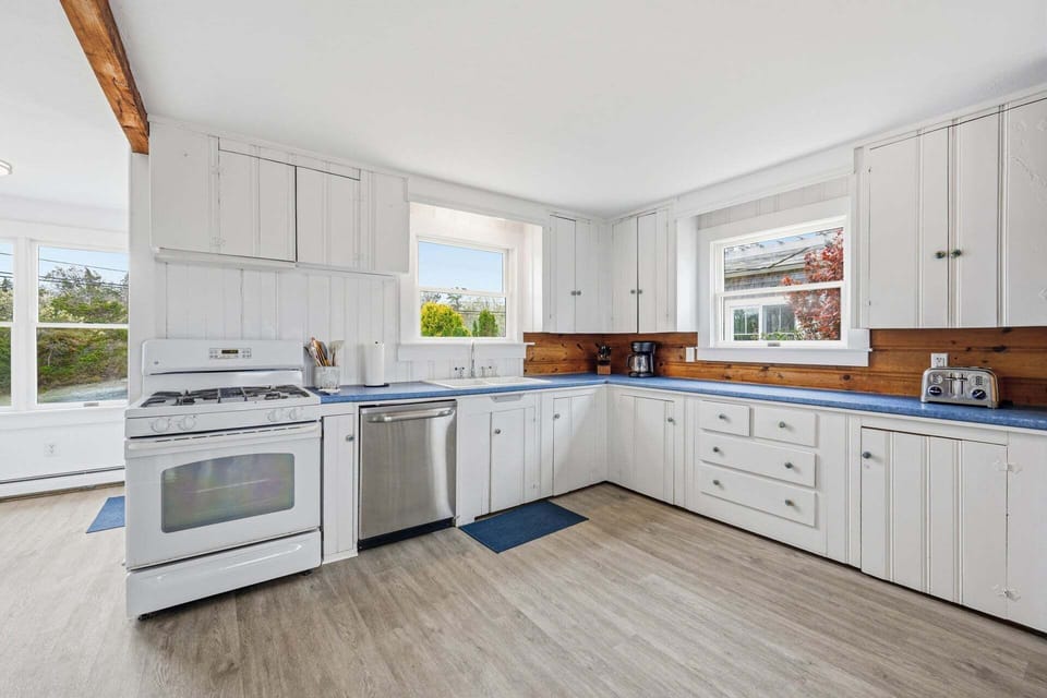Spacious kitchen with an open layout, offering plenty of counter space and room to cook