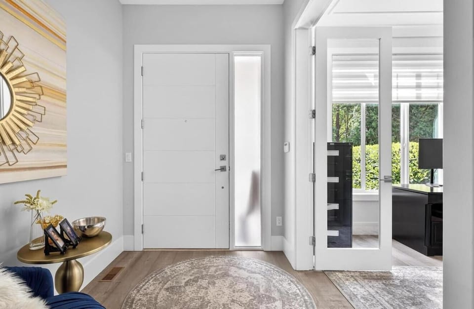 Elegant Entryway: Step into style with modern decor and bright, welcoming views!
