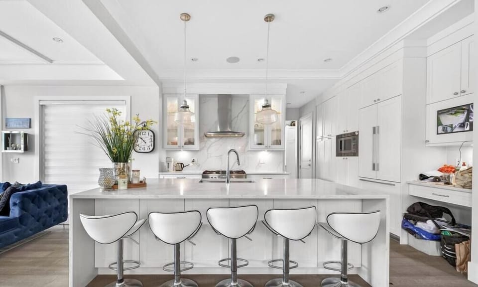 Gourmet Kitchen: Cook up a storm in style with sleek marble countertops and modern seating!
