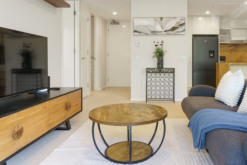 Settle in for a movie night or simply enjoy the calm ambience of this stylish and thoughtfully designed living area.