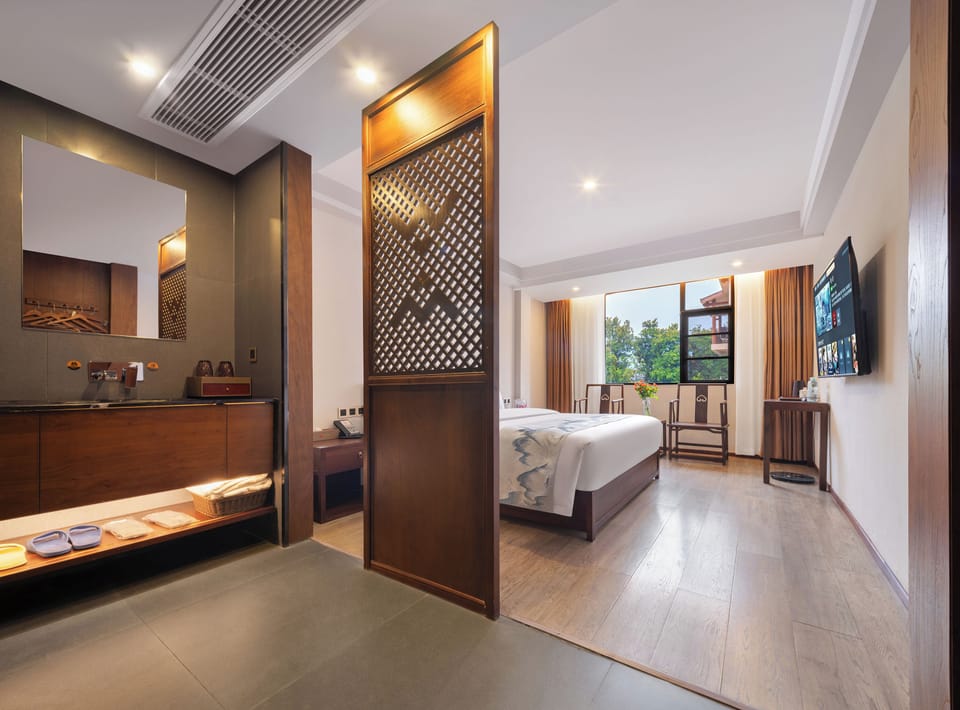 Deluxe Double Room, 1 Queen Bed, Private Bathroom, Courtyard View | In-room safe, blackout drapes, soundproofing, iron/ironing board