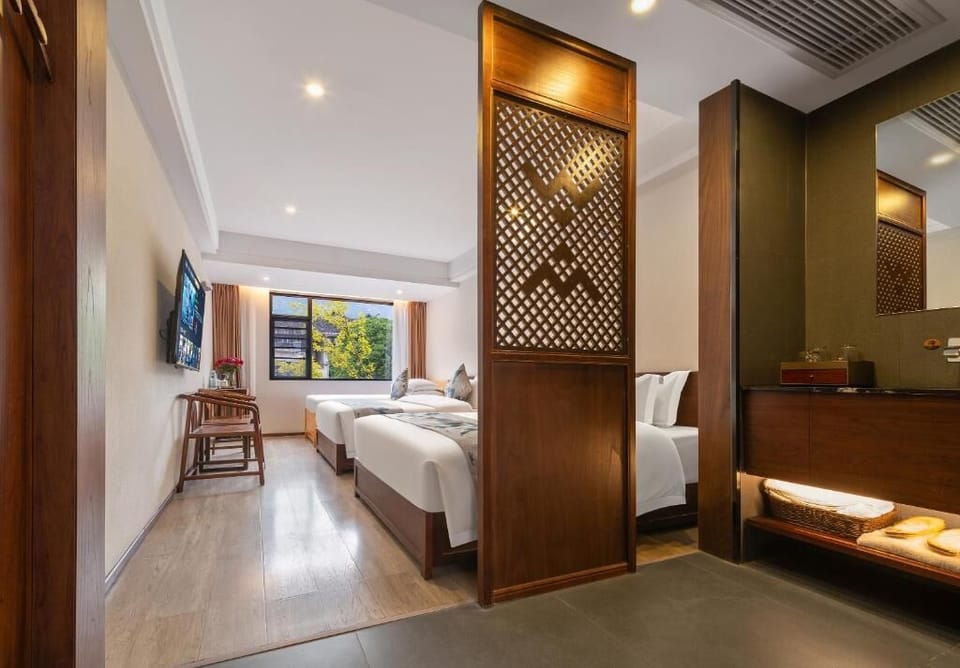 Family Triple Room, Private Bathroom, Courtyard View | In-room safe, blackout drapes, soundproofing, iron/ironing board