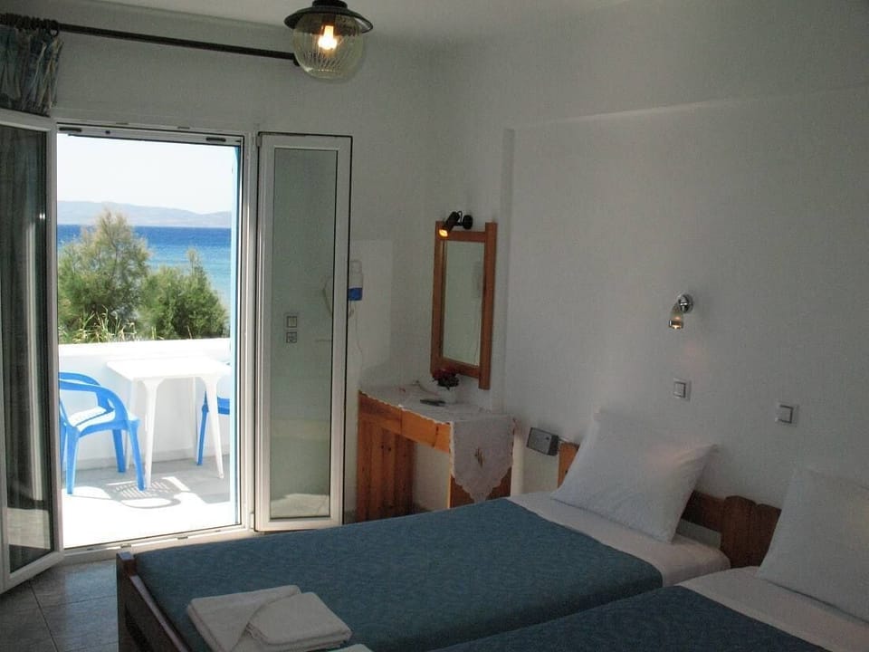 Standard Double Room, Balcony, Beach View | In-room safe, free WiFi