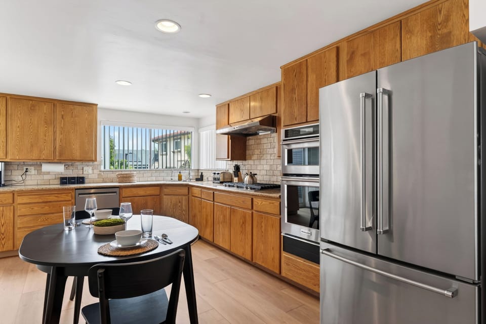 Cozy breakfast nook just off the kitchen with easy flow into the open-concept living and dining spaces.