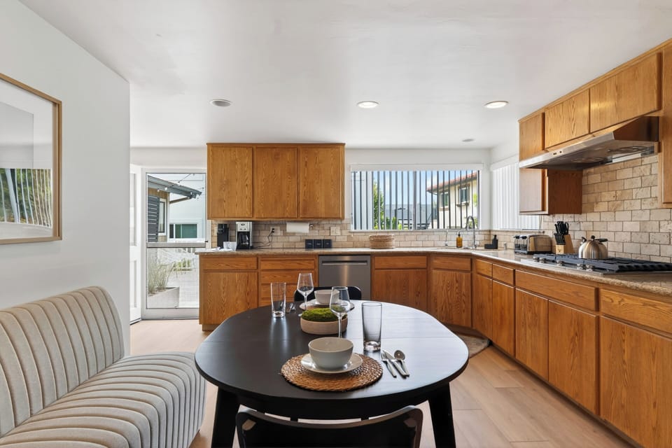 Cozy breakfast nook just off the kitchen with easy flow into the open-concept living and dining spaces.