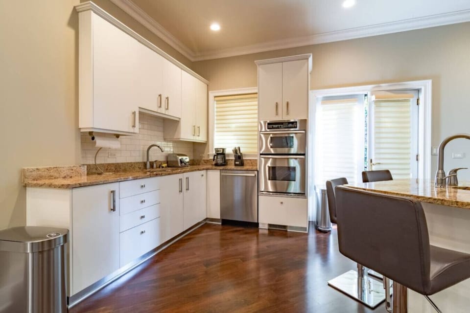 Spa-style bathroom w/ soaking tub, glass shower & soft lighting for a relaxing reset