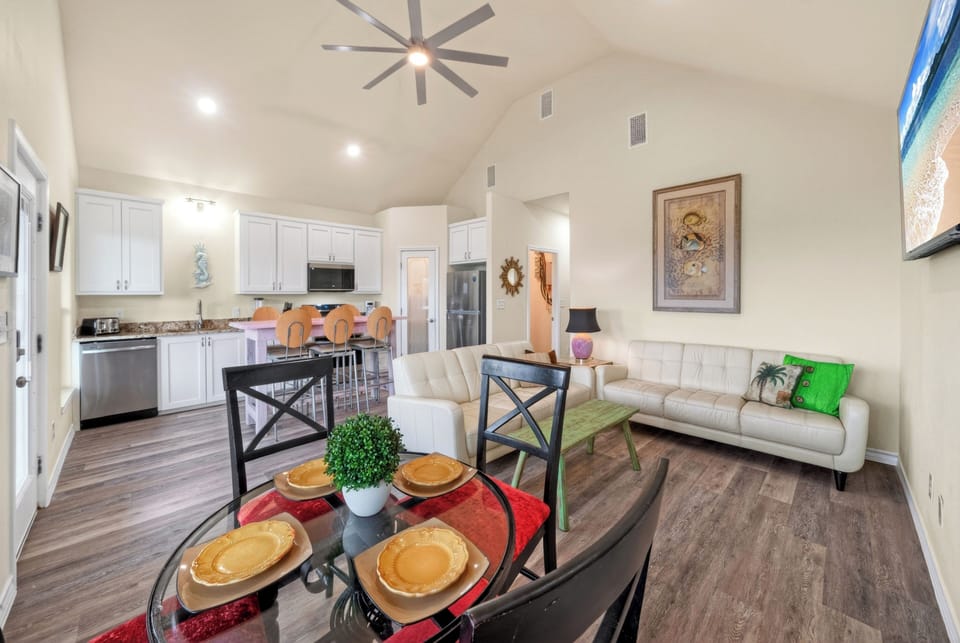 A chef’s-eye view of the open-concept layout, highlighting the effortless connection between kitchen, dining, and living areas.