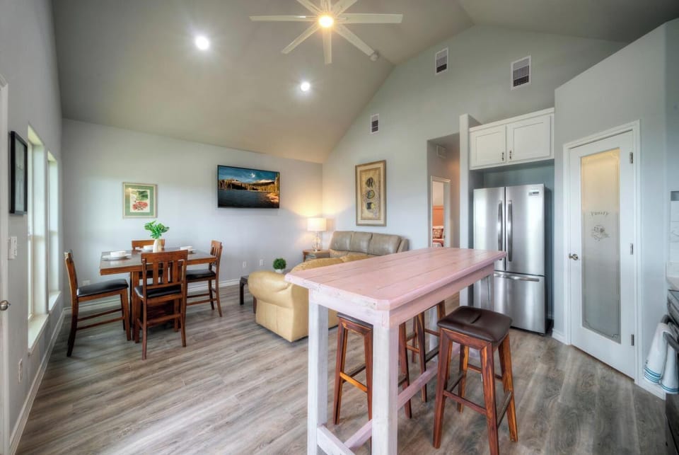 Bright kitchen space with high-top seating and modern finishes.