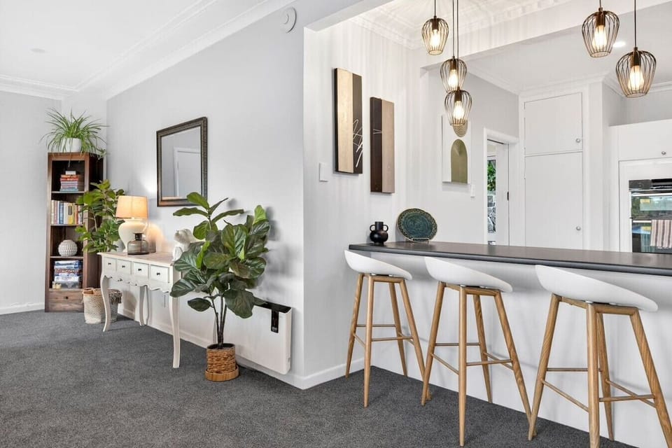 Settle onto your barstool with a morning coffee and watch the lake while pendant lights cast a warm glow over your sleek breakfast bar.