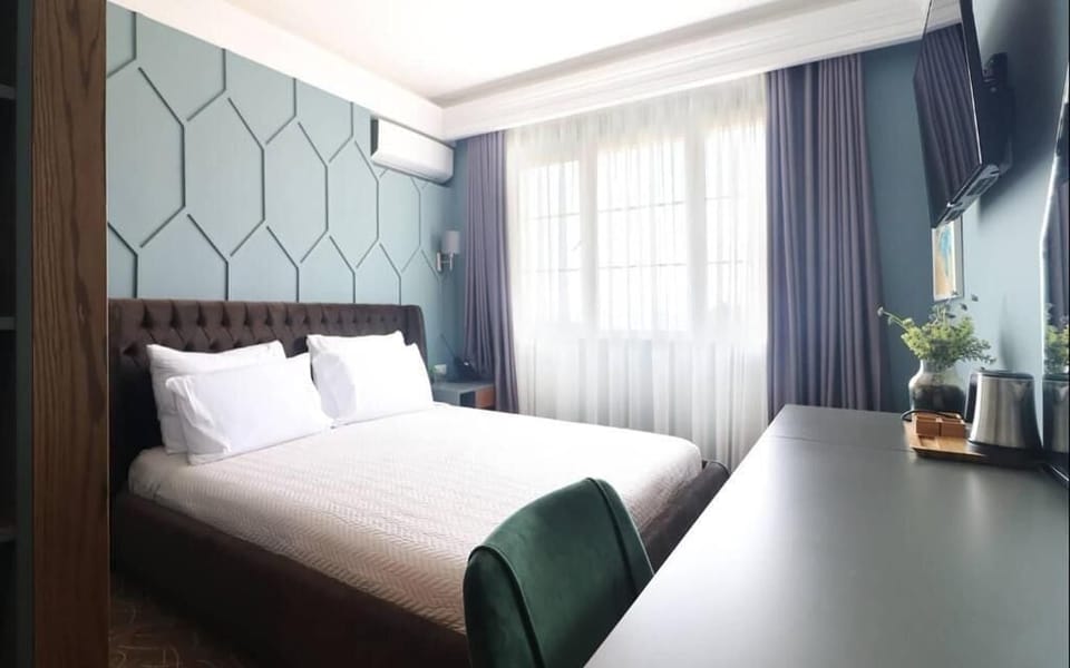 Standard Double Room, Partial Sea View | Desk, laptop workspace, soundproofing, free WiFi
