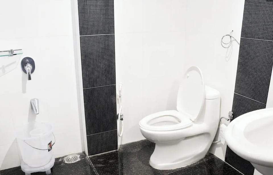 Shower, rainfall showerhead, slippers, towels
