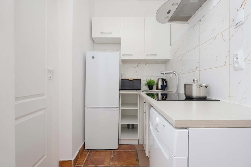 Bright kitchen interior with sleek countertops and ample storage.