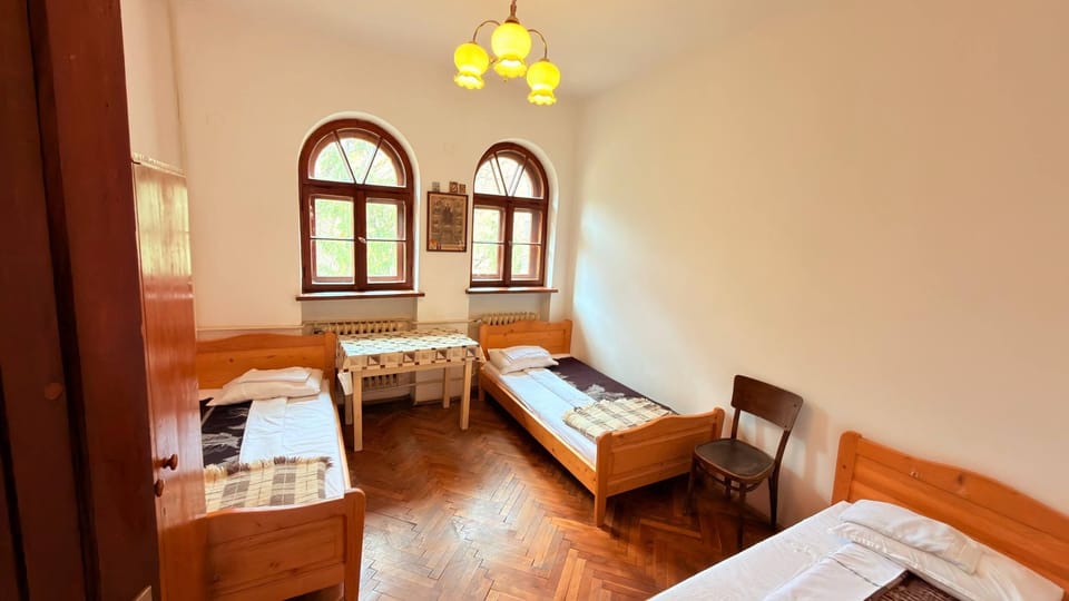 Standard Triple Room, Courtyard View | Desk, laptop workspace, bed sheets