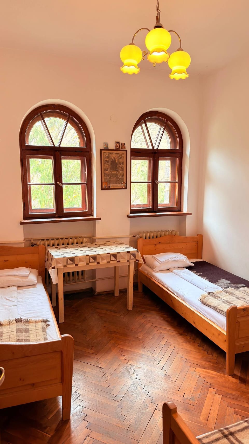 Standard Triple Room, Courtyard View | Desk, laptop workspace, bed sheets