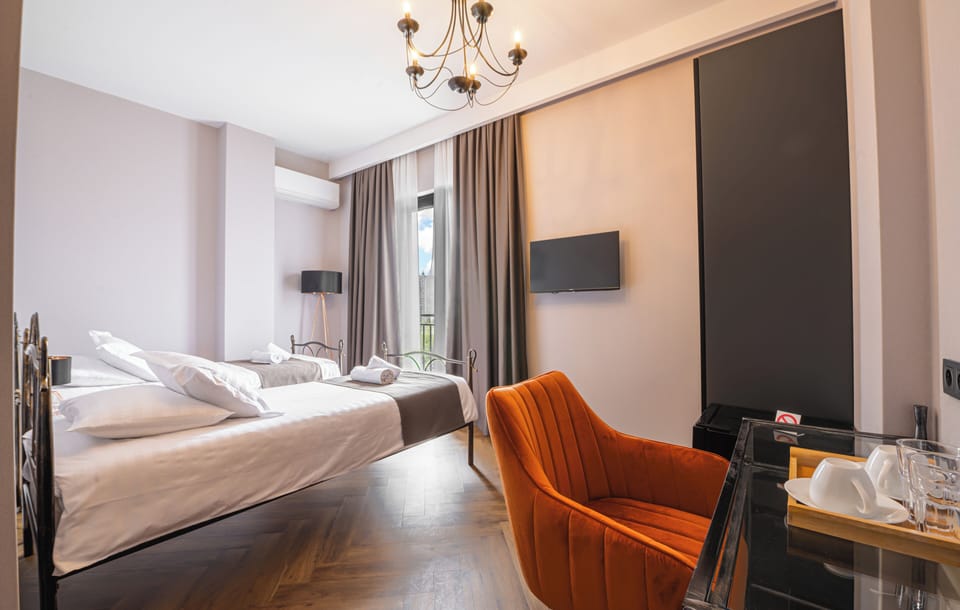 Standard Twin Room, Non Smoking, City View | Minibar, WiFi (free), bed sheets