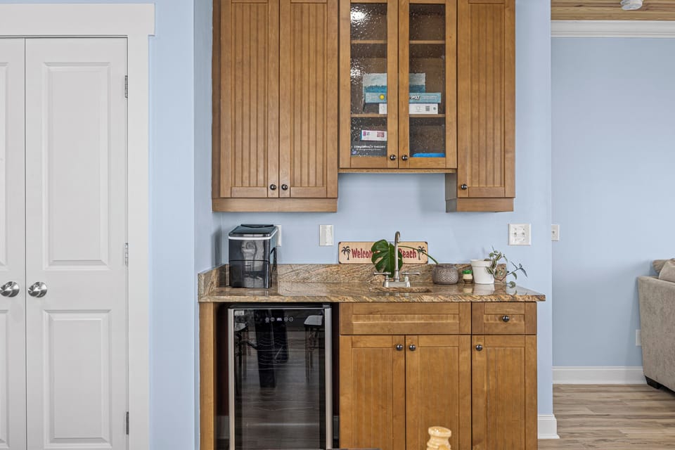 Your kitchenette is ready for relaxation—sleek cabinetry, granite counters, and a beverage cooler to keep drinks chilled and close by.