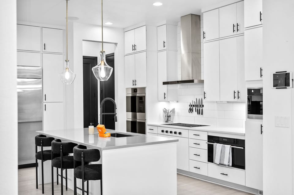 Whip up your favorite meals in this beautifully designed kitchen – includes breakfast bar seating for 3 and a Miele espresso maker