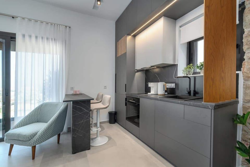 Bright Kitchen Area with Dining Table and Natural Light
