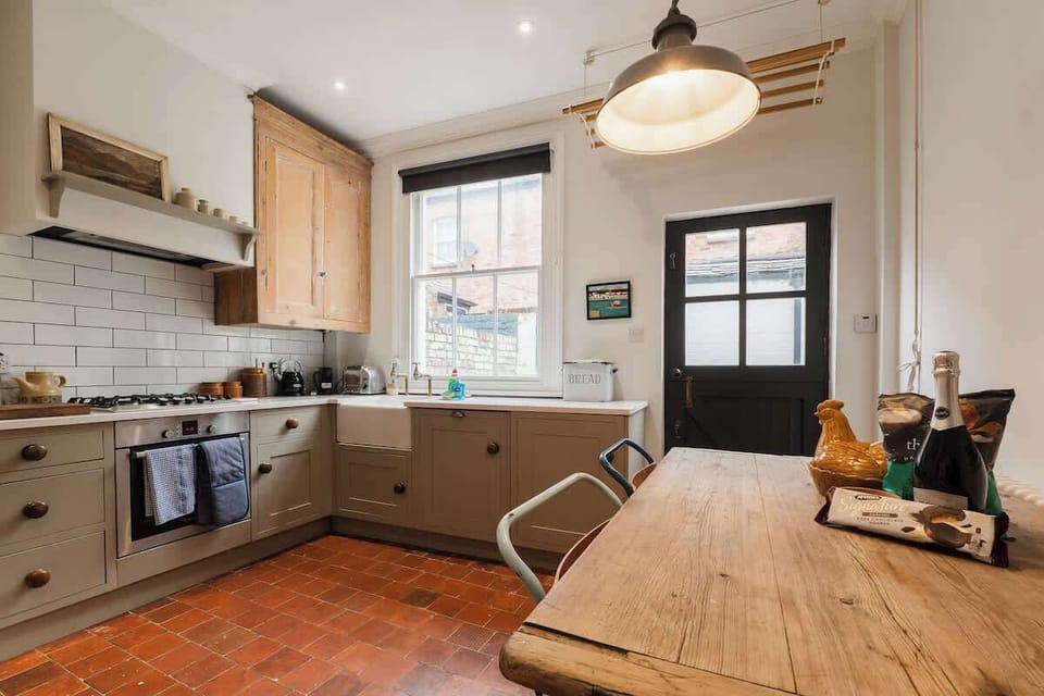 Kitchen:  Original floor, solid wood kitchen cabinets and dining table